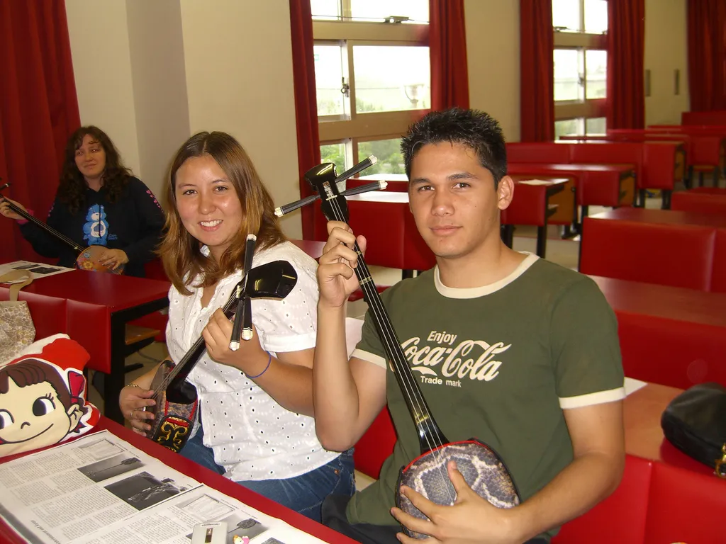 Students learning to play Sanshin, Okinawa's traditional banjo instrument